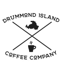Drummond Island outline with a cup of coffee that reads Drummond Island Coffee Company